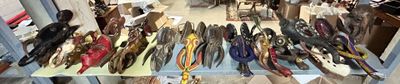 many pairs of shoes that are on display in a store