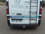 a white van that is parked in a parking lot