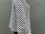 a mannequin mannequin wearing a black and white striped top
