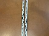 a ruler that is sitting on a table next to a pair of scissors