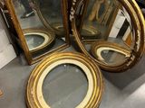 two mirrors are sitting on a table next to each other