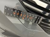 a close up of a sticker on a car ' s front bumper