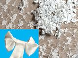 a picture of a pair of white bow ties on a table