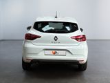 the rear end of a white car in a white room