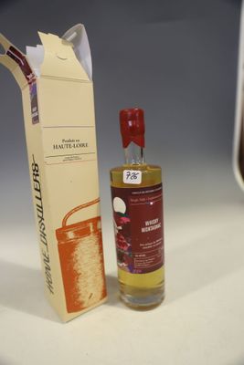 a bottle of wine next to a box of wine