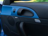 a close up of a car door with a speaker in it