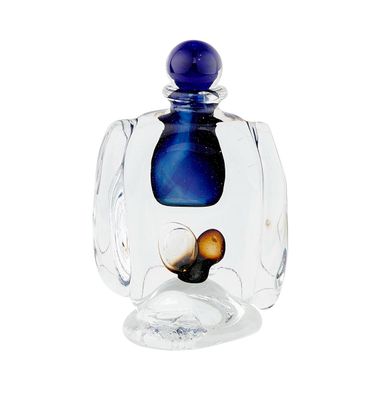 a glass jar with a blue lid and a snail inside of it