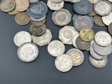 a pile of old coins on a table
