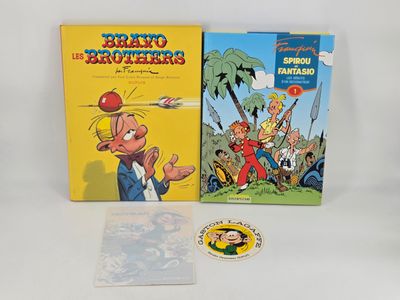 deux livres pour enfants et un autocollant sur une surface blanche