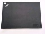 the back of a black laptop computer sitting on top of a white table