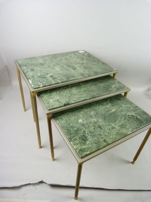 three tables that have green marble tops on them
