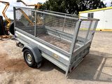 a small trailer with a cage on the back of it