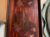 a tray with a painting on it sitting on a table