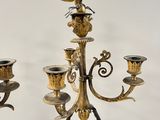 pair of antique brass candelabs with eagle on top of them