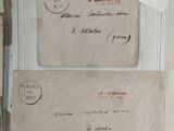 two old envelopes sitting on top of each other