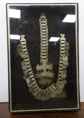 a picture of a picture of a necklace with coins on it