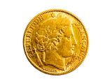 l'image d'une pièce d'or sur laquelle figure une tête de femme