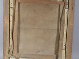 an old picture frame with a picture of a man and a woman