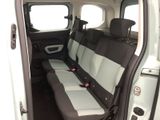 a white van with two black seats in the back of it