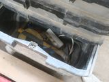 a box with tools inside of it sitting on the floor
