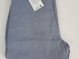 a pair of blue pants with a tag on them