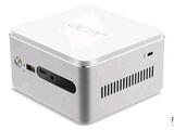une image représentant un petit ordinateur blanc posé sur une surface blanche
