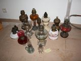 many different types of antique lamps on the floor
