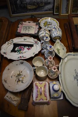 many plates and bowls on a table with pictures
