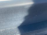 a shadow of a person on the side of a car