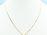 a gold necklace on a mannequin neck with a white background