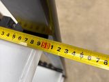 a measuring tape that is on the side of a stove