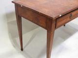 a small wooden table with a drawer on top of it