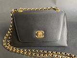 a chanel purse with a chain around it
