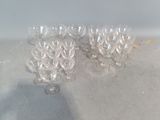 several empty wine glasses sitting on top of a table