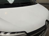 a white van that is parked in a parking lot
