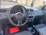 dashboard of a small car with a steering wheel and dashboard controls
