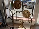 a display of hats and shoes in front of a window