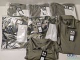 a lot of men ' s clothing on display on a table