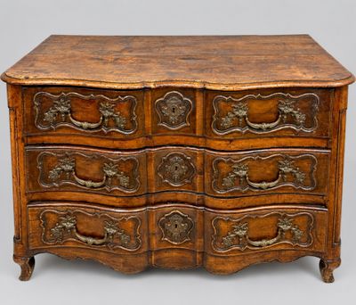 an old wooden chest of drawers with ornate carvings