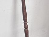 a brown shower head next to a wooden shower head