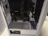 a white computer case sitting on a white table