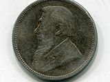 une vieille pièce de monnaie sur laquelle figure l'image d'un homme
