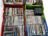 a lot of dvd ' s in a box on the table