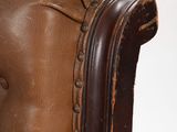 an image of a close up of a brown leather chair