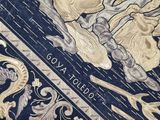 a close up of a book with a gold design on it