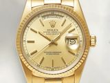 an image of a gold rolex watch on a white background