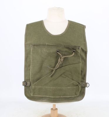 an image of a green apron on a mannequin stand