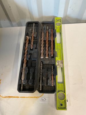 a box of drill bits sitting on a table