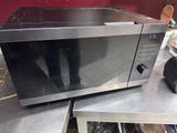 a microwave that is sitting on top of a table