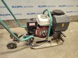 a small machine that is sitting on the ground